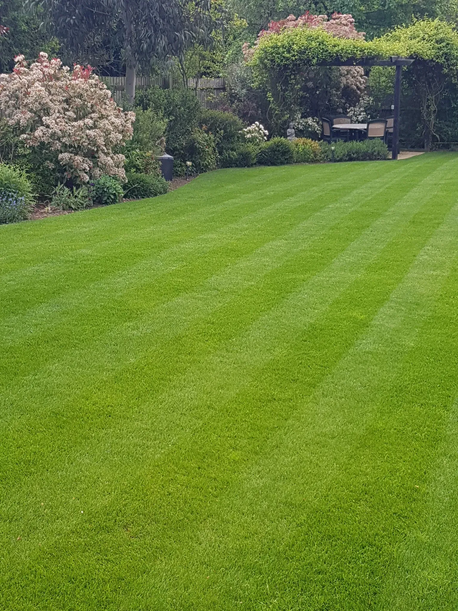 Championship-grade perfectly striped lawn by Green Stripe Lawn Care outside a luxury Cornish home